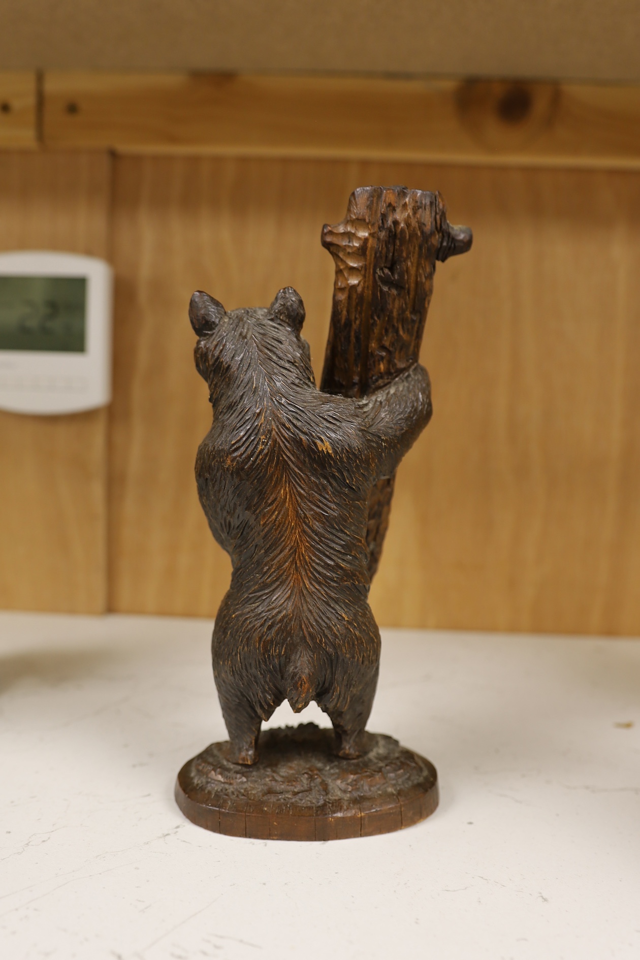 A Black Forest bear stand, 23cm high. Condition - fair needs re waxing